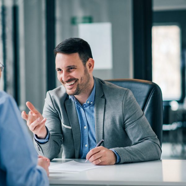 Man having a business meeting and signing a contract, recruitment or agreement. Man having a business meeting and signing a contract, recruitment or agreement.